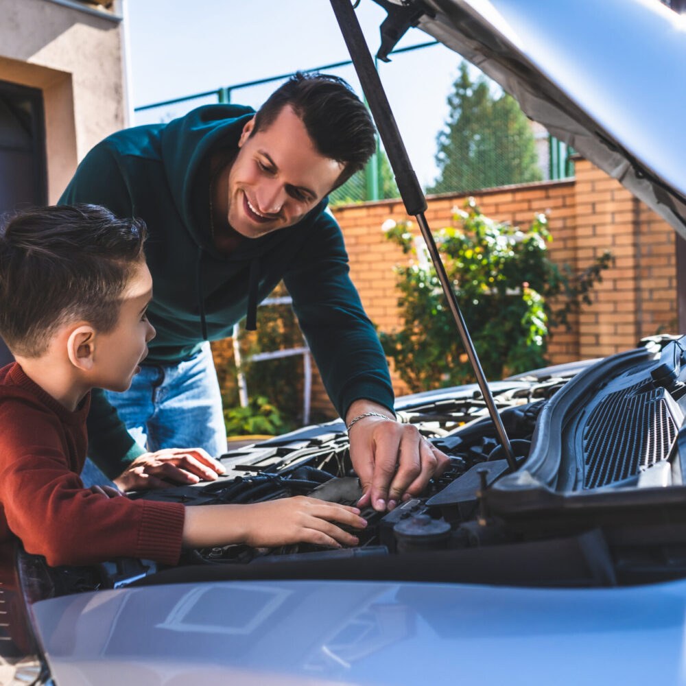 The father and son fixing the car